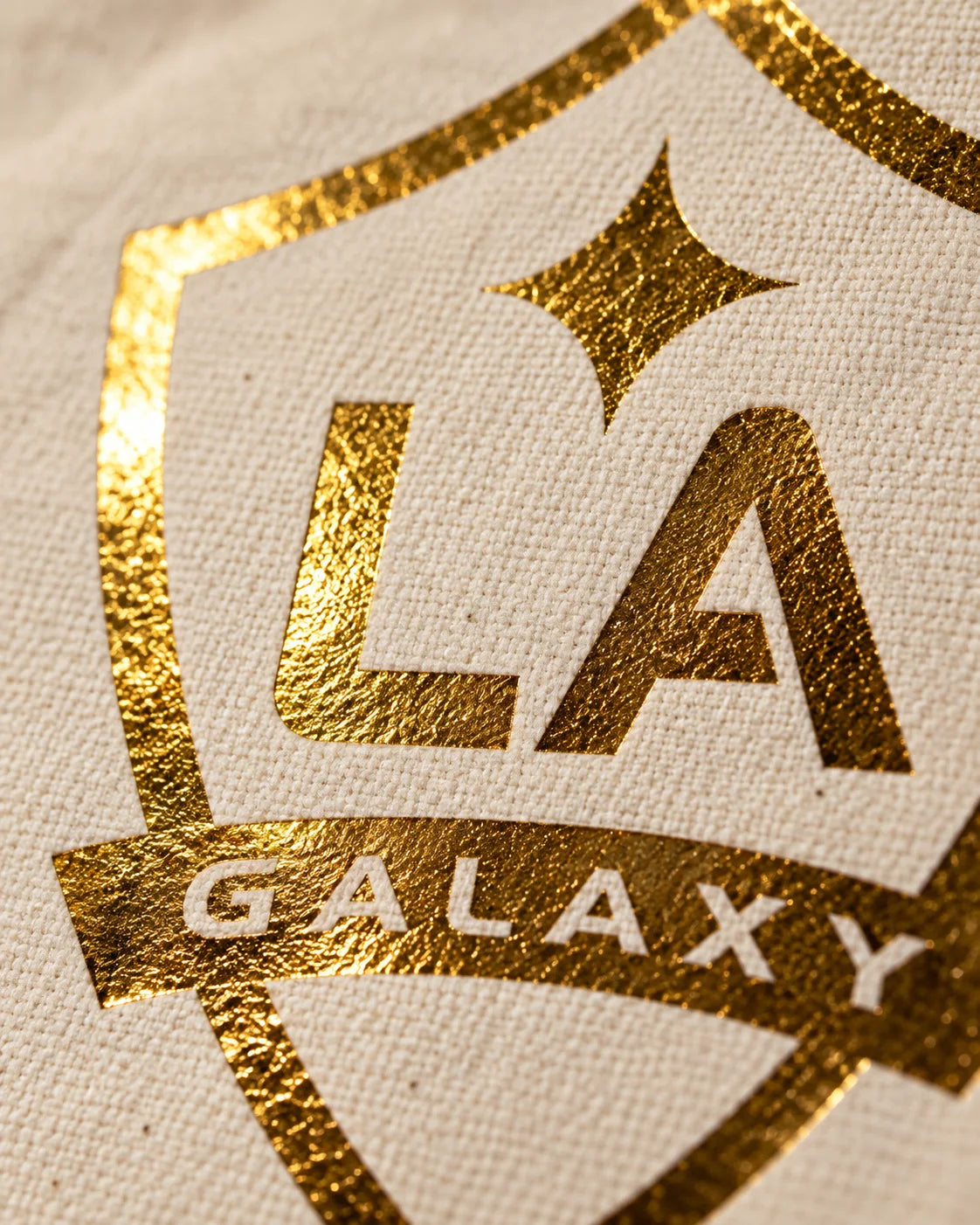 Close-up of the reflective gold foil and canvas texture