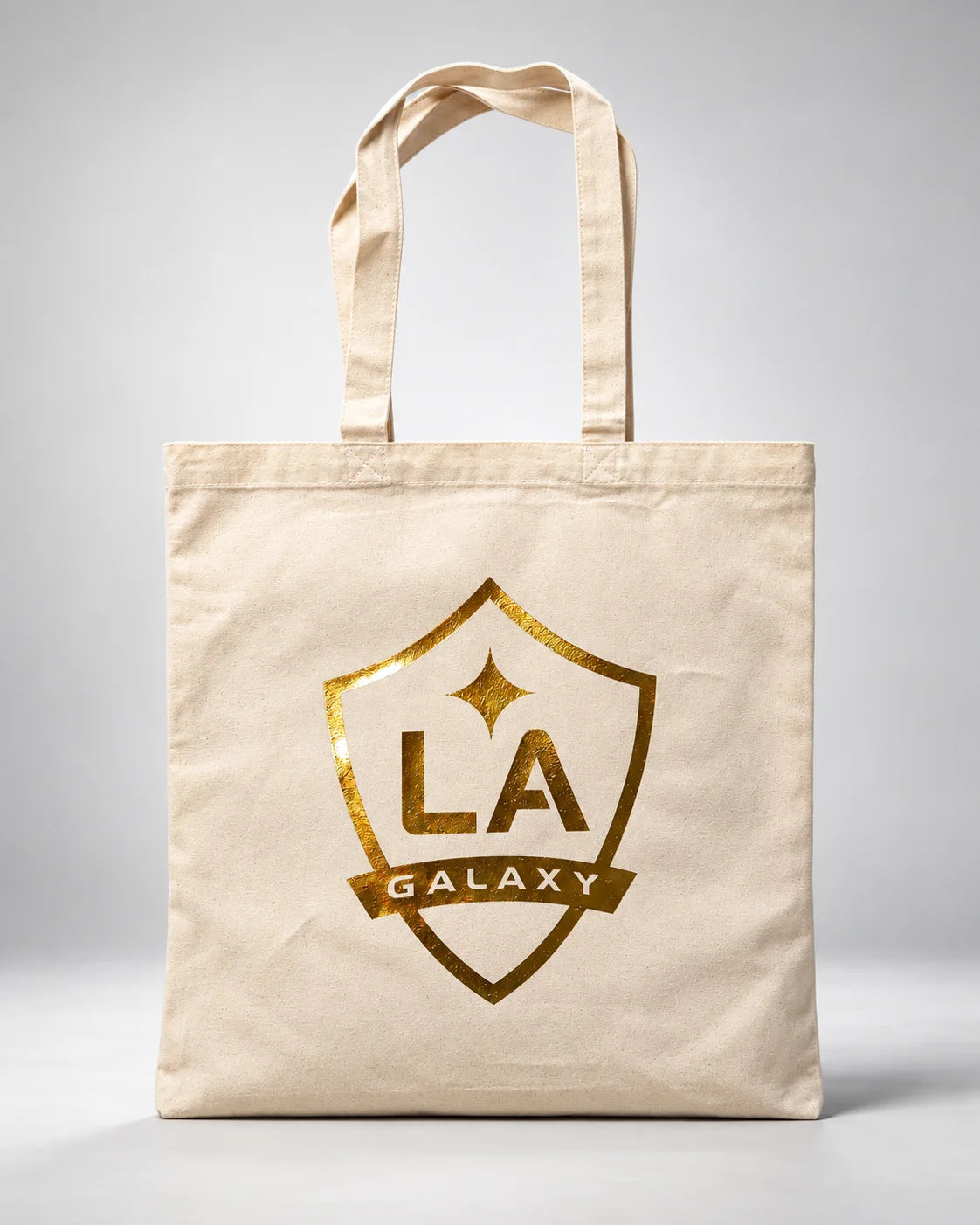 LA Galaxy gold foil crest on a natural canvas tote