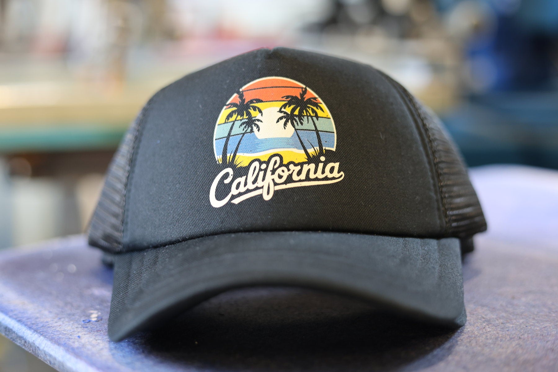 Black California trucker hat with full color decorated front graphic