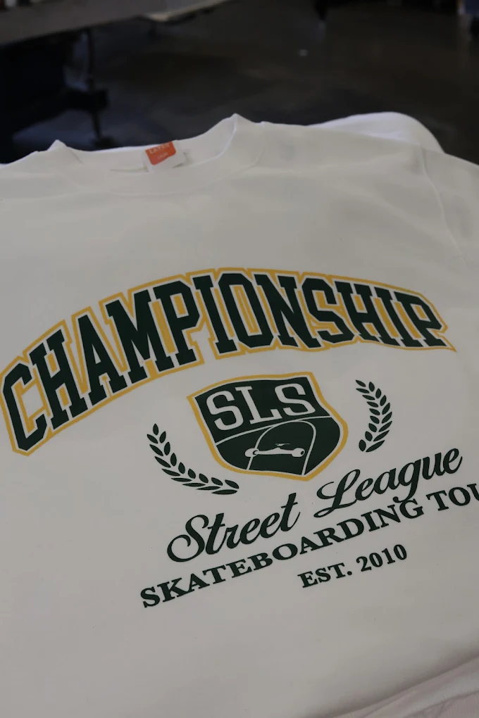 White event t-shirt with championship-style chest print