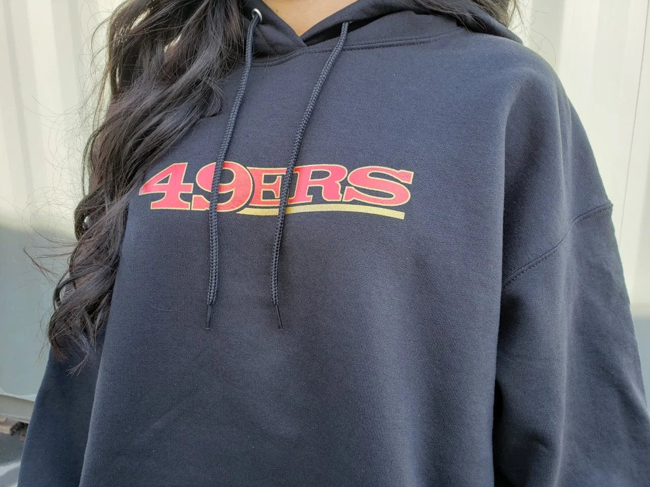 Dark hoodie with red chest logo print