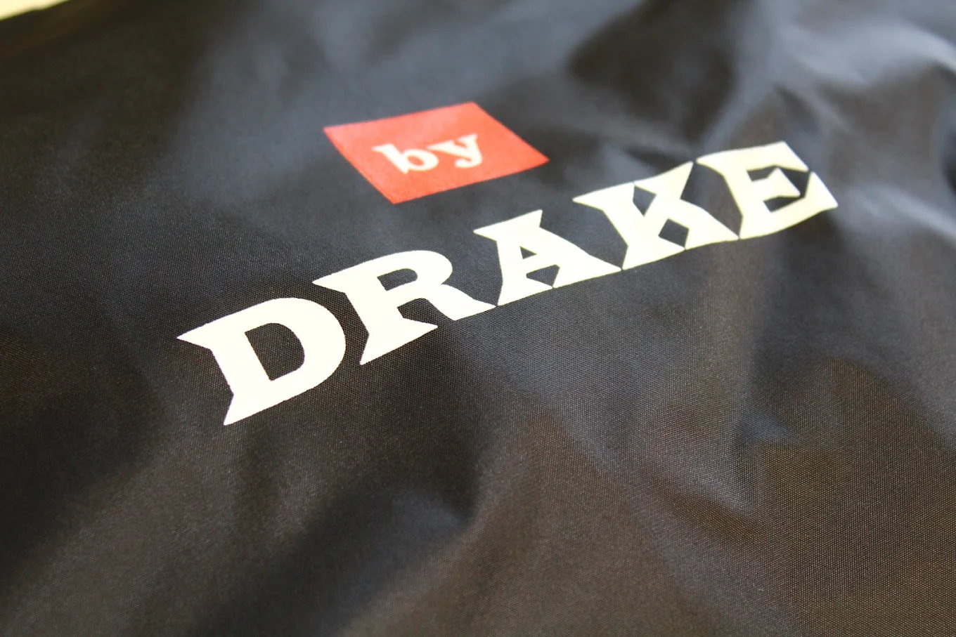 Black garment with clean white chest logo print