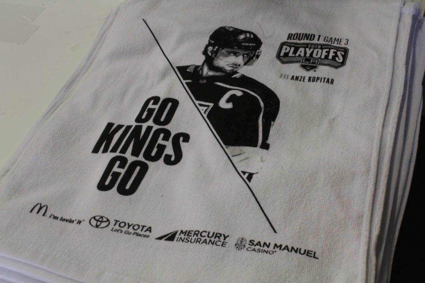 Light event shirts with black player graphic and sponsor print