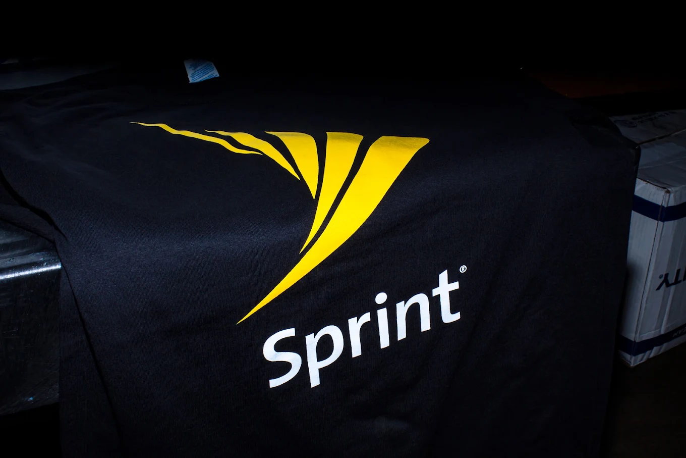Dark jersey with corporate logo print on the front