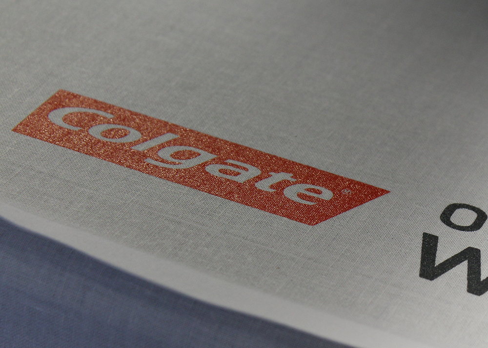 Close-up of small sleeve logo print on a gray garment