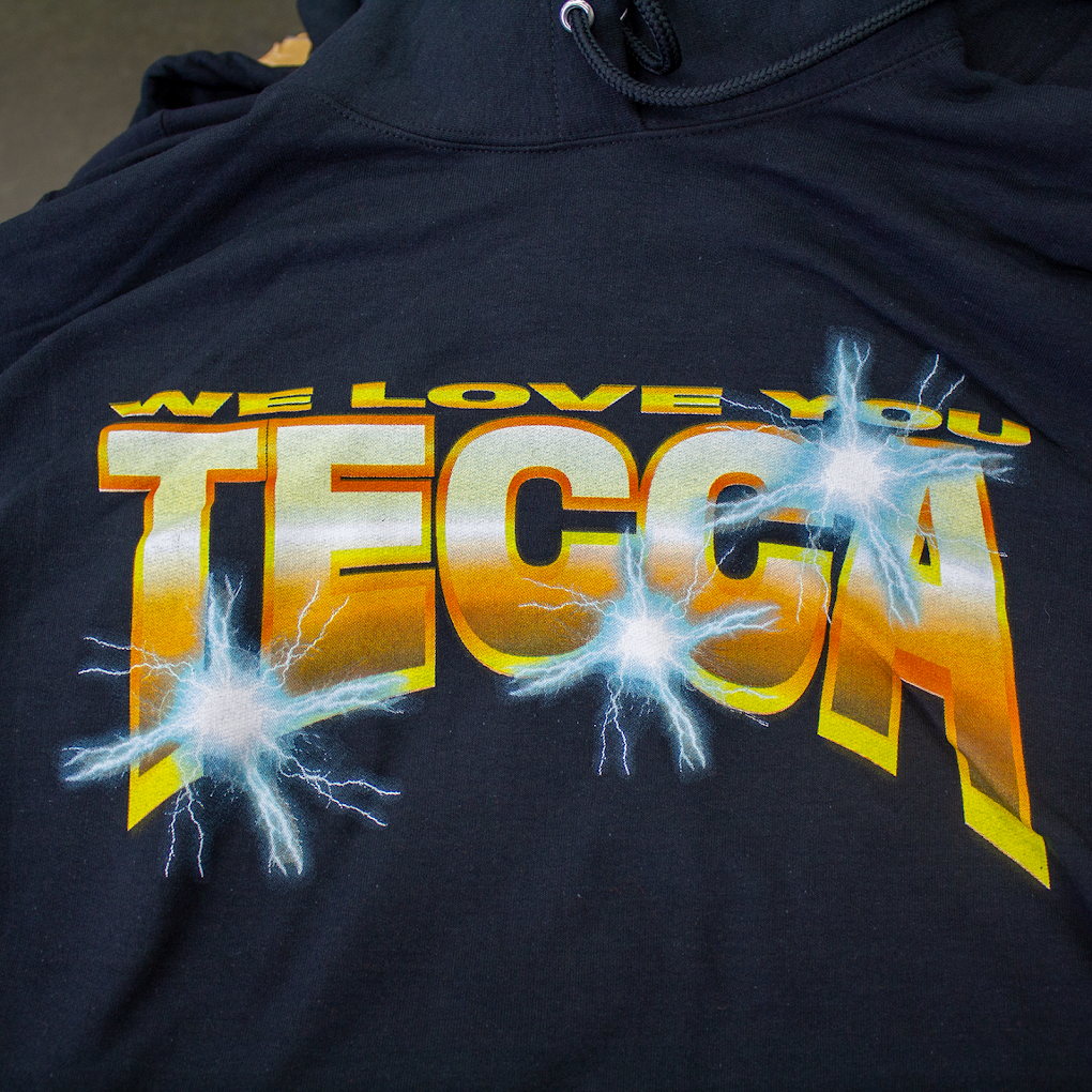 Dark hoodie with large bold back print and lightning artwork