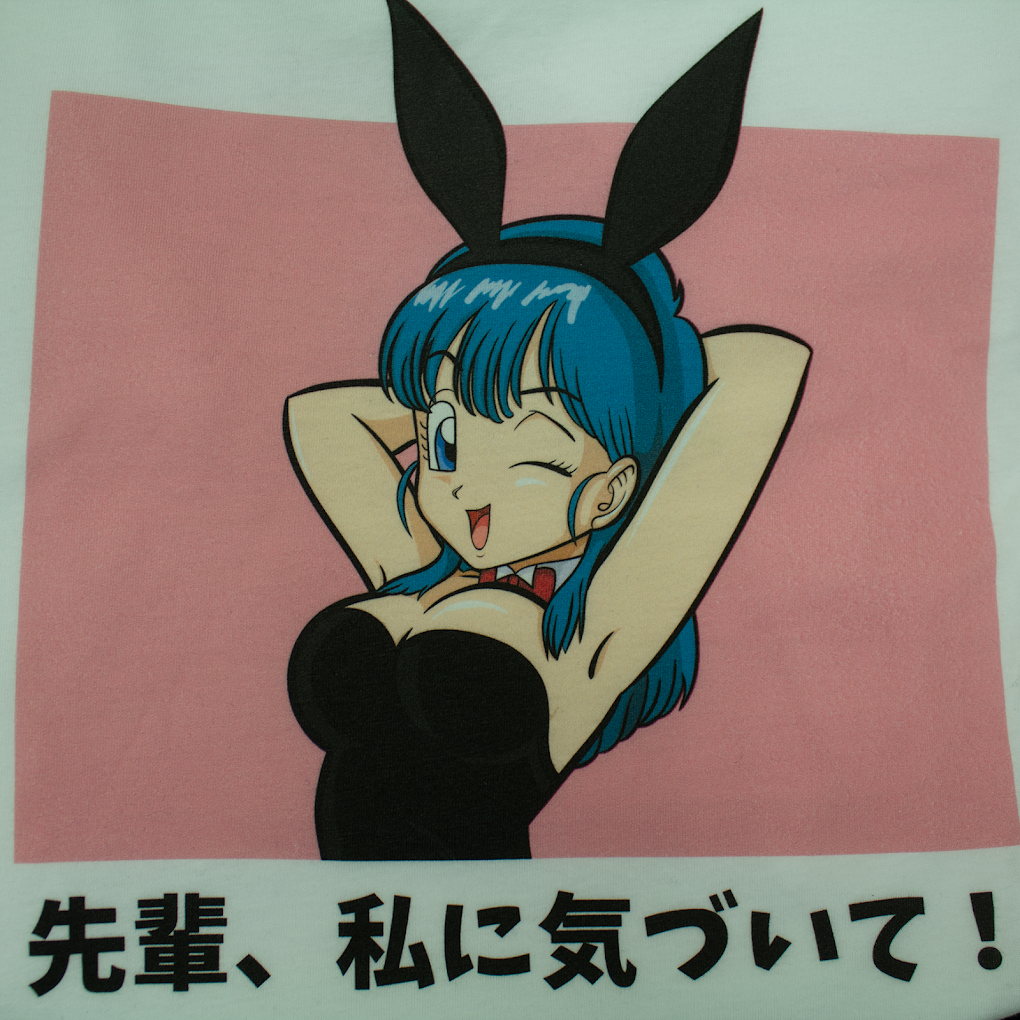 Pink shirt with full-color anime poster-style graphic print