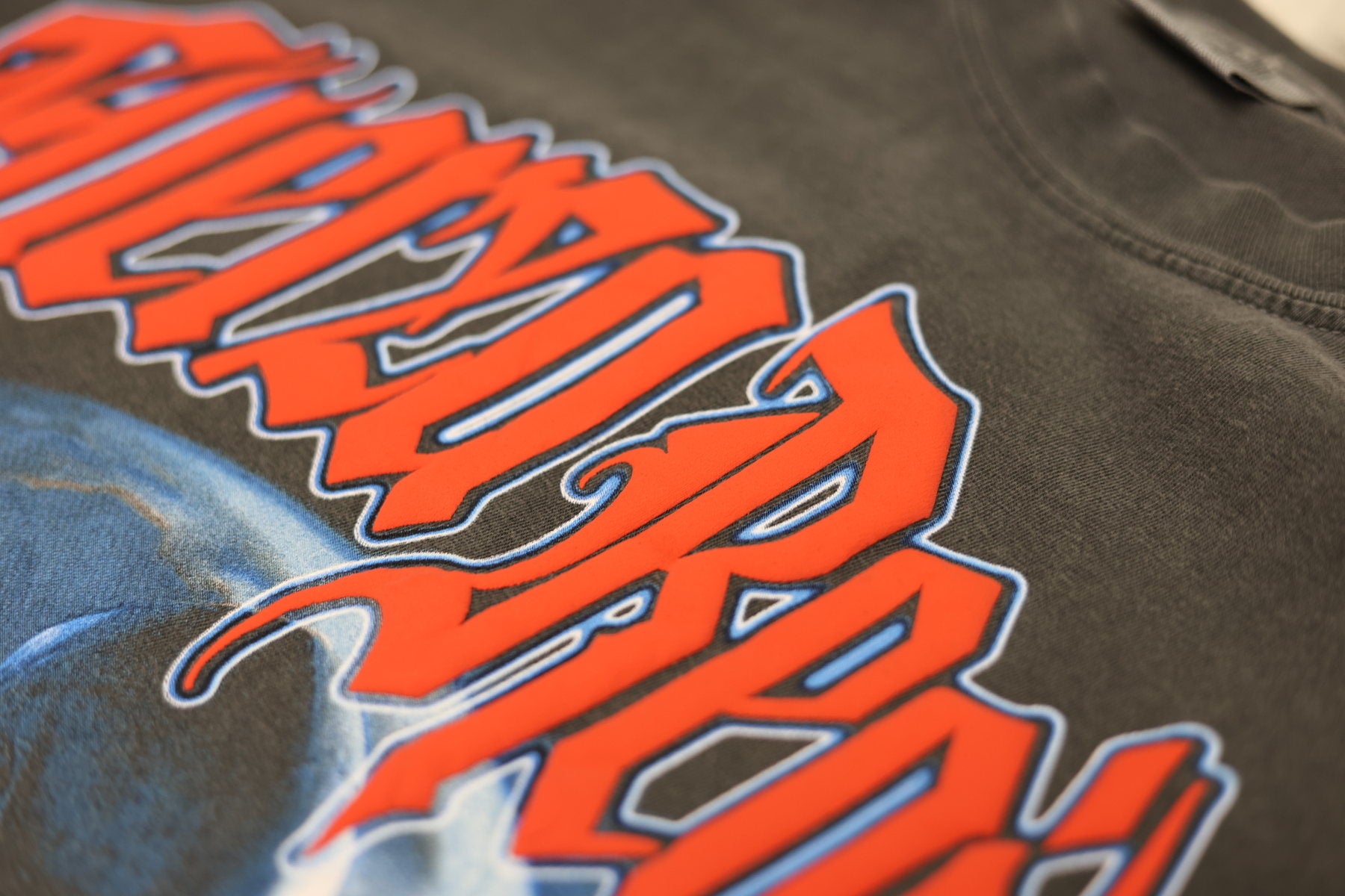 Close-up of bold red screen print detail on a garment